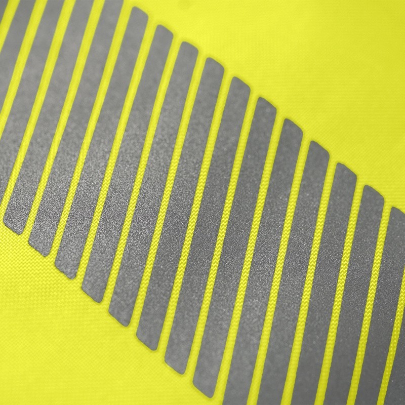 Détail tissu pantalon haute visibilité jaune bandes réfléchissantes SINGER