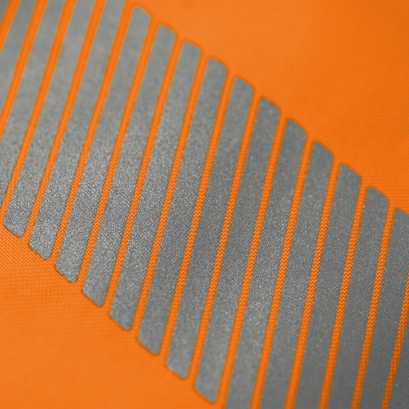Détail tissu pantalon haute visibilité orange bandes réfléchissantes SINGER